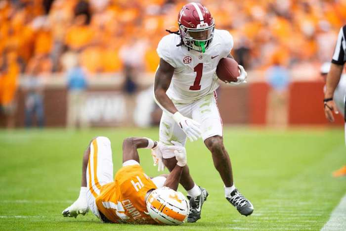 Alabama running back Jahmyr Gibbs (1) runs past Tennessee defensive back Christian Charles (14) during Tennessee's game against Alabama in Neyland Stadium in Knoxville, Tenn., on Saturday, Oct. 15, 2022.